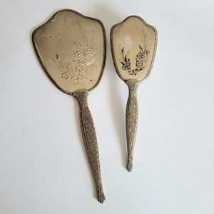 Vintage hand mirror with and hair brash. Vanity set. Made in USA.